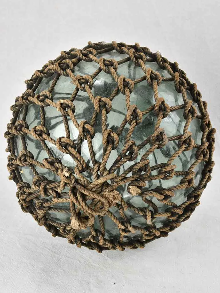 Netted glass fishing float 1930s,  12½"