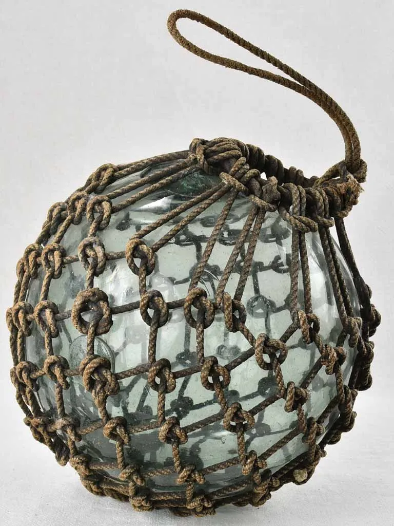 Netted glass fishing float 1930s,  12½"