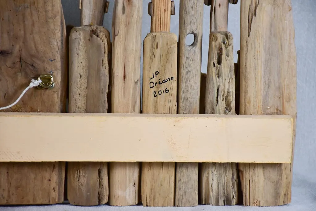 Panoramic driftwood sculpture by JP Dreano - 31 characters 28¾"