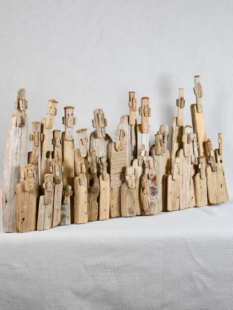 Panoramic driftwood sculpture by JP Dreano - 31 characters 28¾"