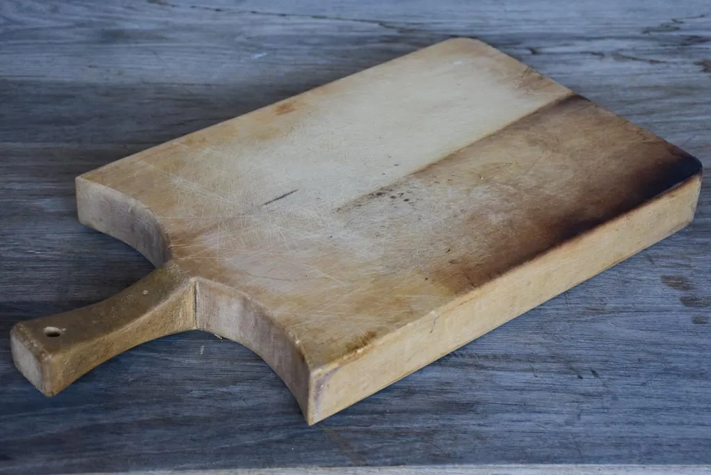 Thick antique French cutting board with rounded peaked shoulders 20¾"