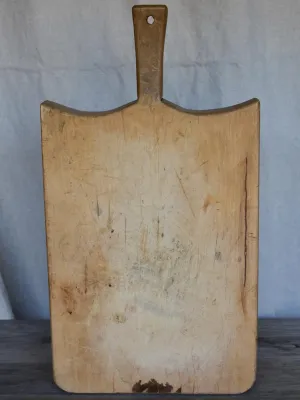 Thick antique French cutting board with rounded peaked shoulders 20¾"