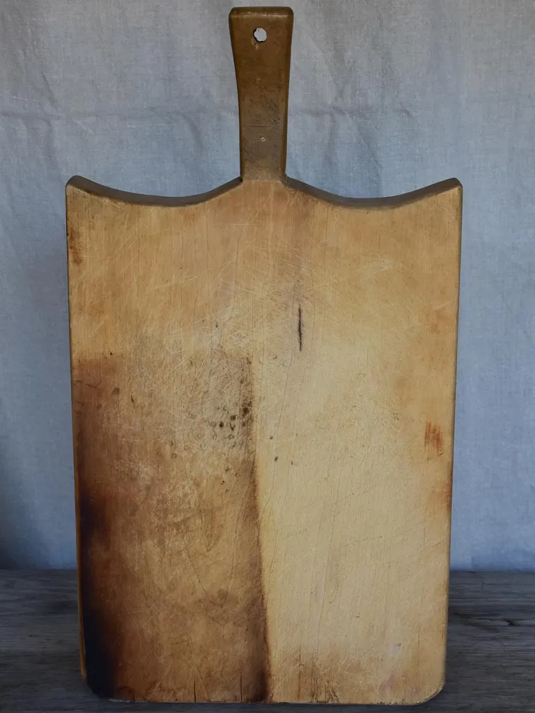 Thick antique French cutting board with rounded peaked shoulders 20¾"